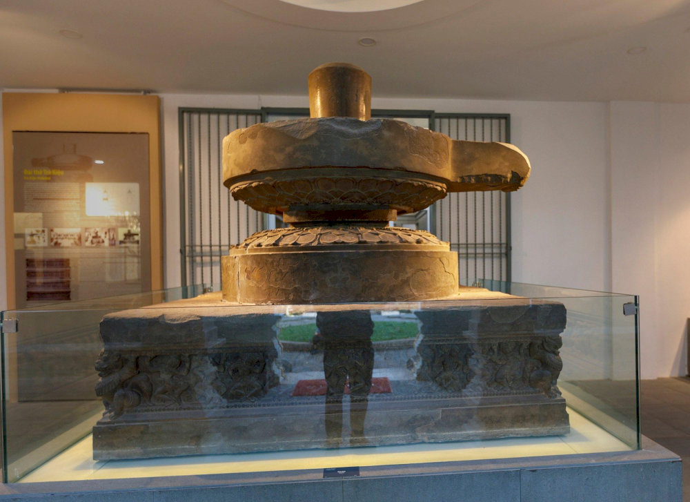 The Tra Kieu altar, adorned with celestial dancers and a goddess figure, reflects Cham artistry and devotion to Hindu deities 
